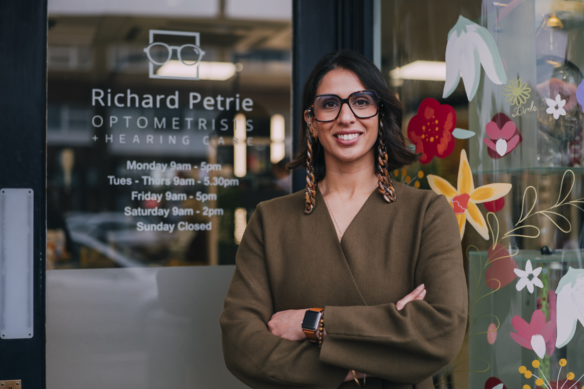 the richard petrie team are posing in the reception area